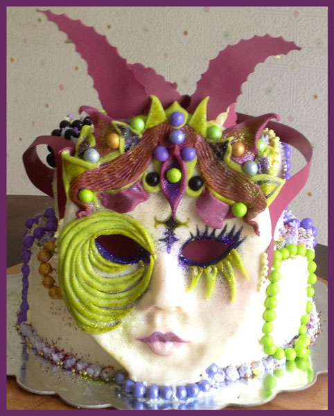 Mardi Gras cake decorated in modeling chocolate